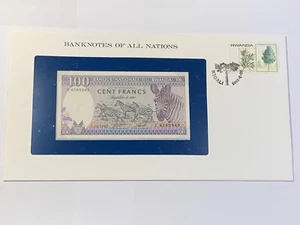 Banknote E Umschlag Ruanda 100 Francs 1982 Neu + Karte (102-18/A0-93) - Bild 1 von 3