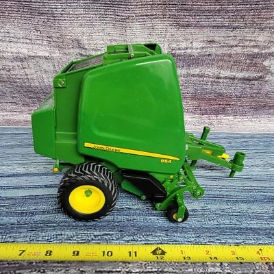 Empacadora redonda Ertl Britains escala 1/16 John Deere 854 con paca de plástico verde/amarillo Foto 1 de 4