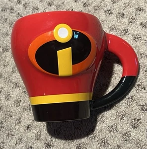 INCREDIBLES PIXAR SUPER HERO COSTUME 12 OZ COFFEE MUG OFFICIAL DISNEY NEW - Picture 1 of 2