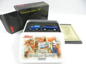 1:90 Schuco 05274 Unimog 401 mit Anhänger Christmas Special 2002 #5309 - Bild 1 von 2
