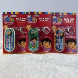 3 Llaveros con Clip Mochila Dora la Exploradora con Tapas Deslizantes Colecciona los 3 - Imagen 1 de 11