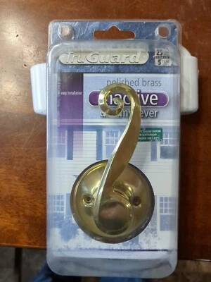 Manija de puerta de palanca de maniquí inactiva de latón pulido TruGuard Foto 1 de 4