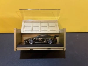1/64 TARMAC WORKS PORSCHE 997 OLD & NEW BLACK & GOLD TRIM JOHN PLAYER SPECIAL - Picture 1 of 3