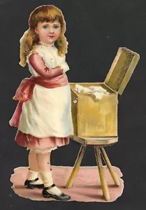 Antique Victorian Die Cut Paper Embossed Girl with Small Trunk of Fabric - Picture 1 of 2
