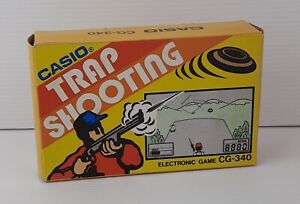 CASIO ELECTRONIC GAME CG-340 TRAP SHOOTING VINTAGE HANDHELD GAME & WATCH NUOVO