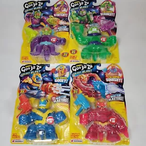 GOO JIT ZU Heroes GALAXY BLAST Set of 4 Water Blasters Stretchy Action Figures - Picture 1 of 9