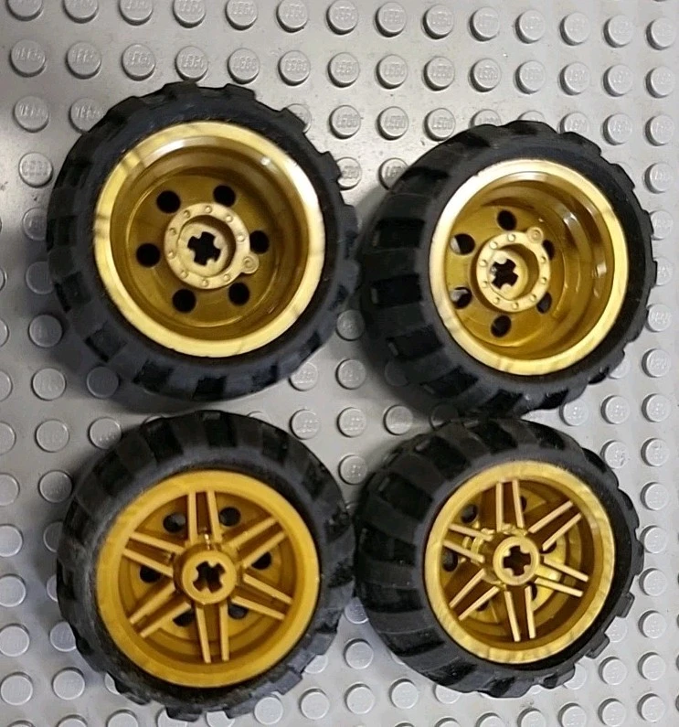 Lego 4 Stück Technic Rad Felge 30.4x22.8 6580 Gold Reifen 43.2x28 6579 schwarz  - Bild 1 von 2