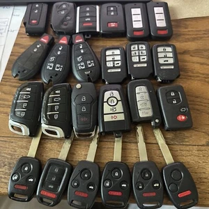 LOT OF 24 ALL AFTERMARKET KEY REMOTE FOBS MIXED BRANDS & STYLES - NO RETURNS - Picture 1 of 2