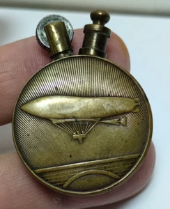 WWI Biplane & Zeppelin Blimp Round Brass 1 1/4" Trench Lighter JGBx26 - Picture 1 of 6