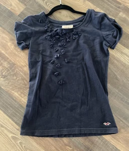 T-shirt Hollister blu con volant mini fiocchi junior taglia XS - Foto 1 di 11