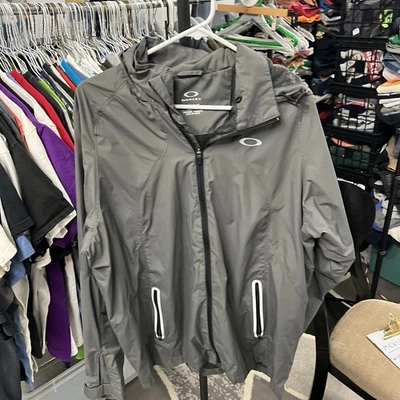 Chaqueta cortavientos forrada con capucha y cremallera completa gris Oakley para hombre talla XL Foto 1 de 4