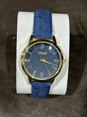 Reloj Vivani esfera azul redondo tono dorado caja azul denim correa lona necesita batería Foto 1 de 4
