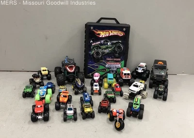 Lot of Monster Truck Toys Cars with a Hot Wheels Case - Image 1 of 4