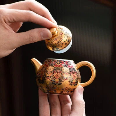 Tetera dorada 24K porcelana bola en forma infusora agujeros olla maestra macetas hechas a mano Foto 1 de 4