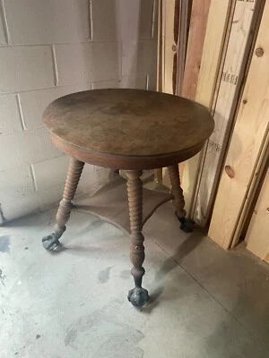 Antigua mesa de salón de madera con patas de garra de metal y vidrio mesa redonda única Foto 1 de 4