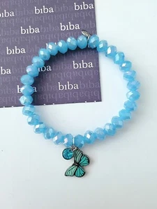 Biba, Kristall Armband mit Schmetterling + Solitär dehnbar 18 cm türkis Neu/F100 - Bild 1 von 1