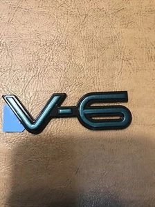 NOS GM 22571273 OEM 1994 - 1998 Pontiac Grand Am V-6 Fender Emblem - Picture 1 of 3