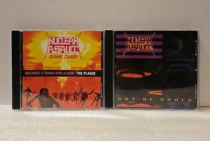 Nuclear Assault 2 CD Lot Game Over & Out Of Order DISCS MINT - Imagen 1 de 12