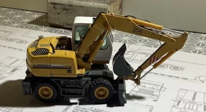 Conrad Liebherr 914 Bagger in Maßstab 1:50. - Bild 1 von 4