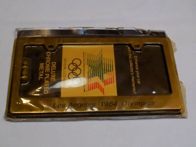 Marco porta etiquetas de metal cromado plateado olímpico de Los Ángeles 1984 nuevo de stock Foto 1 de 3