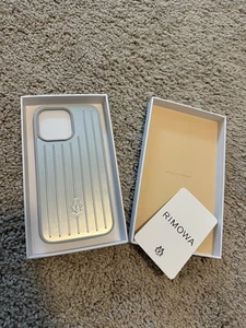 Coque téléphone Rimowa Iphone 15 Pro Max aluminium argenté NEUVE - Photo 1 sur 3