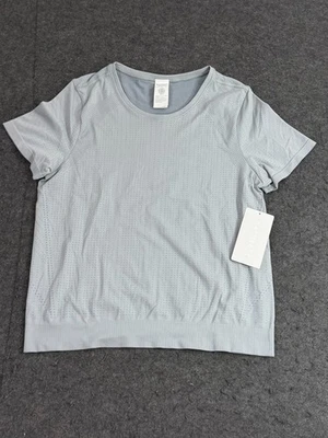 NWT Athleta In Motion Seamless Tee Large Grey Heather Hem Gripper Crew Neck Top - Image 1 of 4