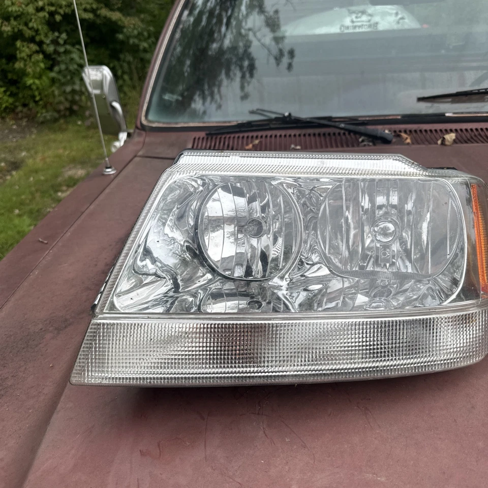 Faro de repuesto delantero izquierdo jeep grand cherokee 99-04 Foto 1 de 4