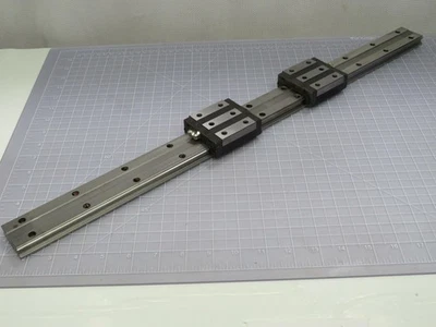 LOT OF 2 THK HRW27 LINEAR RAIL BEARING GUIDE BLOCKS ON 25 IN RAIL T172269 - Image 1 of 4