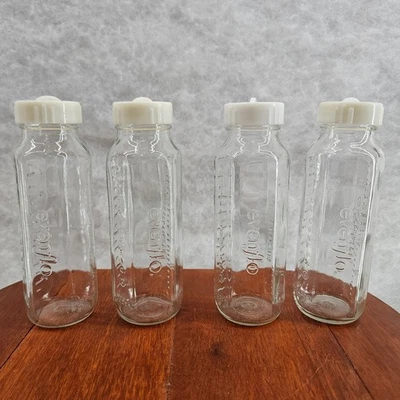 Juego de 4 biberones de vidrio Evenflo de 8 oz con tapas blancas de colección hechos en EE. UU. Foto 1 de 4
