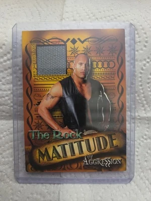 2003 Fleer WWE Aggression - Matitude The Rock #MR Mat Relic  - Image 1 of 2