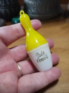 Vintage 1960s bowling pin shaped travel, purse rain bonnet. Yellow - Picture 1 of 3