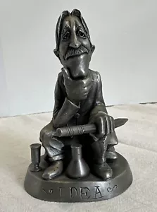 Statua in peltro dell'uomo pensante IDEA TIMBRATA JOHNSON WAX sul fondo Jon Cryl - Foto 1 di 12