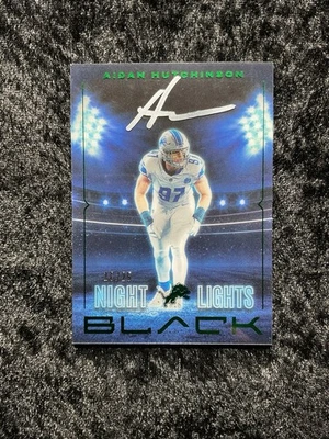 AIDAN HUTCHINSON AUTO NIGHT LIGHTS GREEN SSP 16/25 2025 PANINI BLACK FOOTBALL - Image 1 of 2