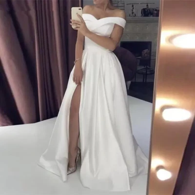Vestidos de novia blancos marfil satinado hombros descubiertos sin espalda altos divididos Foto 1 de 4