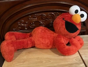 Sesame Street Large Elmo Laying Down Plush - 26 Inches. Fisher-Price, Inc. - Picture 1 of 5