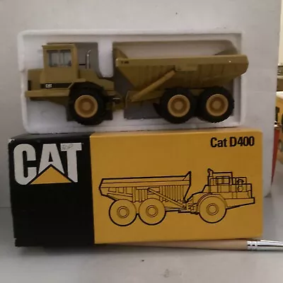 CONRAD Ref 2862 CAT D400 ARTICULATED DUMPER TRUCK COME ORIGINAL BOX ITEM UNUSED - Image 1 of 4