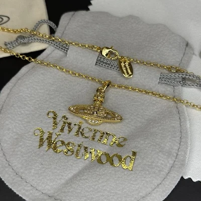 Collana ciondolo pianeta sfera originale oro Vivienne Westwood nuova con scatola - Immagine 1 di 4