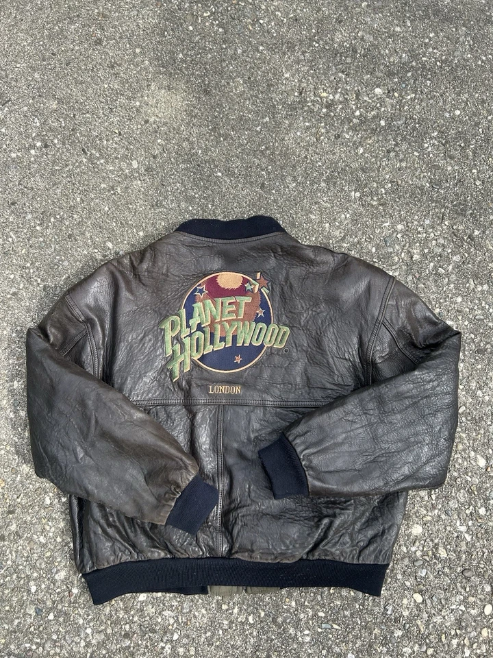 Chaqueta reversible acolchada vintage 1990 Planet Hollywood cuero marrón oliva  Foto 1 de 4