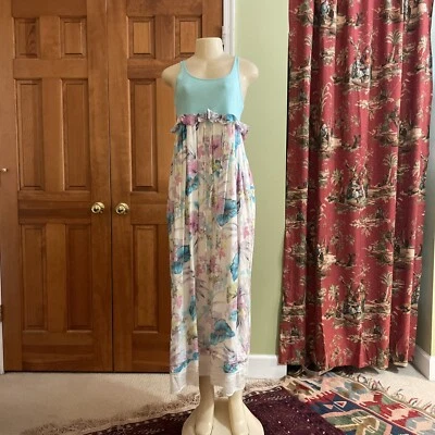 Maxi vestido floral Manoush para mujer sin mangas con volantes y cordón 500,00 Ret Foto 1 de 4