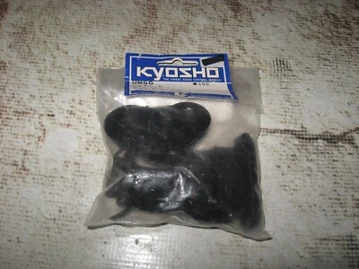 RC Kyosho Spares / Bulkhead Cover set Plastic Black UM50 - Image 1 of 2
