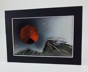 Painting of an Orange and Black Planet by Jason Girard comes with a colorful mat