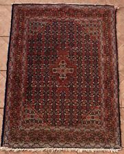 An antique Senneh rug