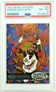 HAKEEM OLAJUWON 1997 Fleer Metal Universe #59 casi nuevo-como nuevo PSA 8 - Imagen 1 de 3