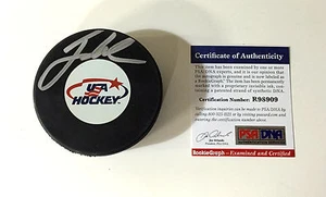 JACK EICHEL SIGNED USA HOCKEY PUCK PSA/DNA COA ROOKIE GRAPH BUFFALO SABRES - Picture 1 of 3