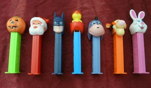 VINTAGE LOT OF 7 PEZ DISPENSERS: PUMPKIN/CHICK/ BUNNY/SANTA/BATMAN/TIGGER/EEYORE - Picture 1 of 7