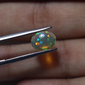 Cabochon ovale 10x8 mm 1,5 cts naturale AAA verde blu arcobaleno fuoco etiope opale - Foto 1 di 8