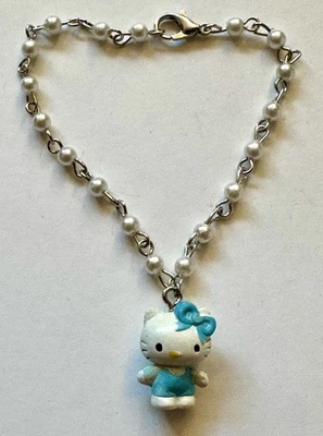 HELLO KITTY ENCANTO PLÁSTICO AZUL 3/4 de 1" imitación perlas pulsera AJUSTABLE 7" Foto 1 de 3