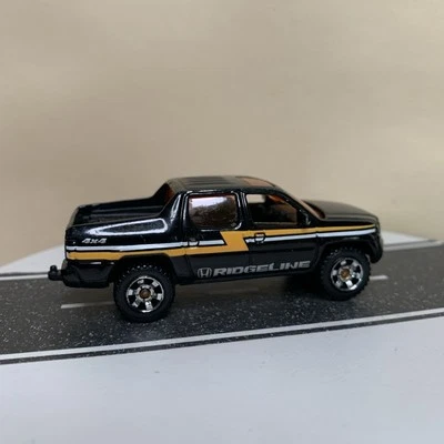 Miras exteriores Matchbox MBX 2012 Honda Ridgeline 2007 negro/naranja 1:69 GC Foto 1 de 4