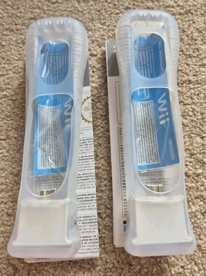 2x Official Nintendo Wii Motion Plus Adapters white  + Official Silicone Sleeves - Image 1 of 4