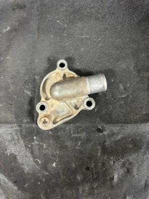 USED OEM 01-07 SUZUKI RM 125 RM125 ENGINE MOTOR WATER PUMP COVER 17411-36F00 - Image 1 of 2